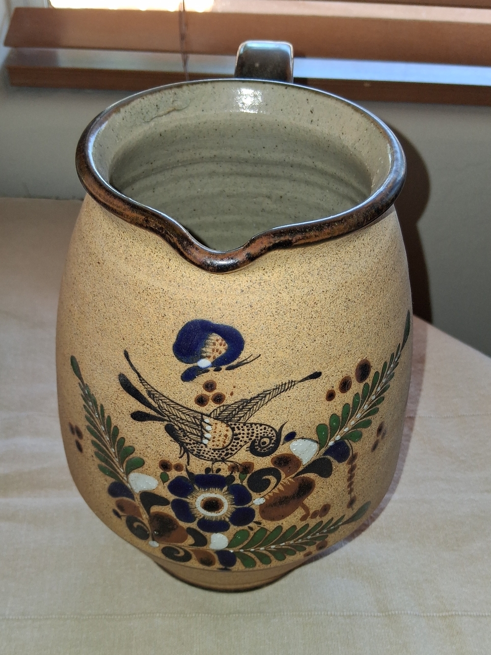 Hand-Painted Ceramic Pitcher with Blue and Green Floral Bird Motif